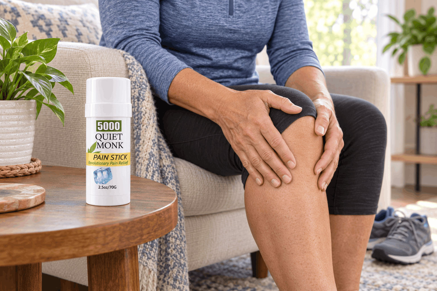 Quiet Monk 5000mg CBD pain stick beside a person rubbing their knee